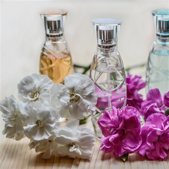 Perfume Flowers Bottles iPad Pro wallpaper 