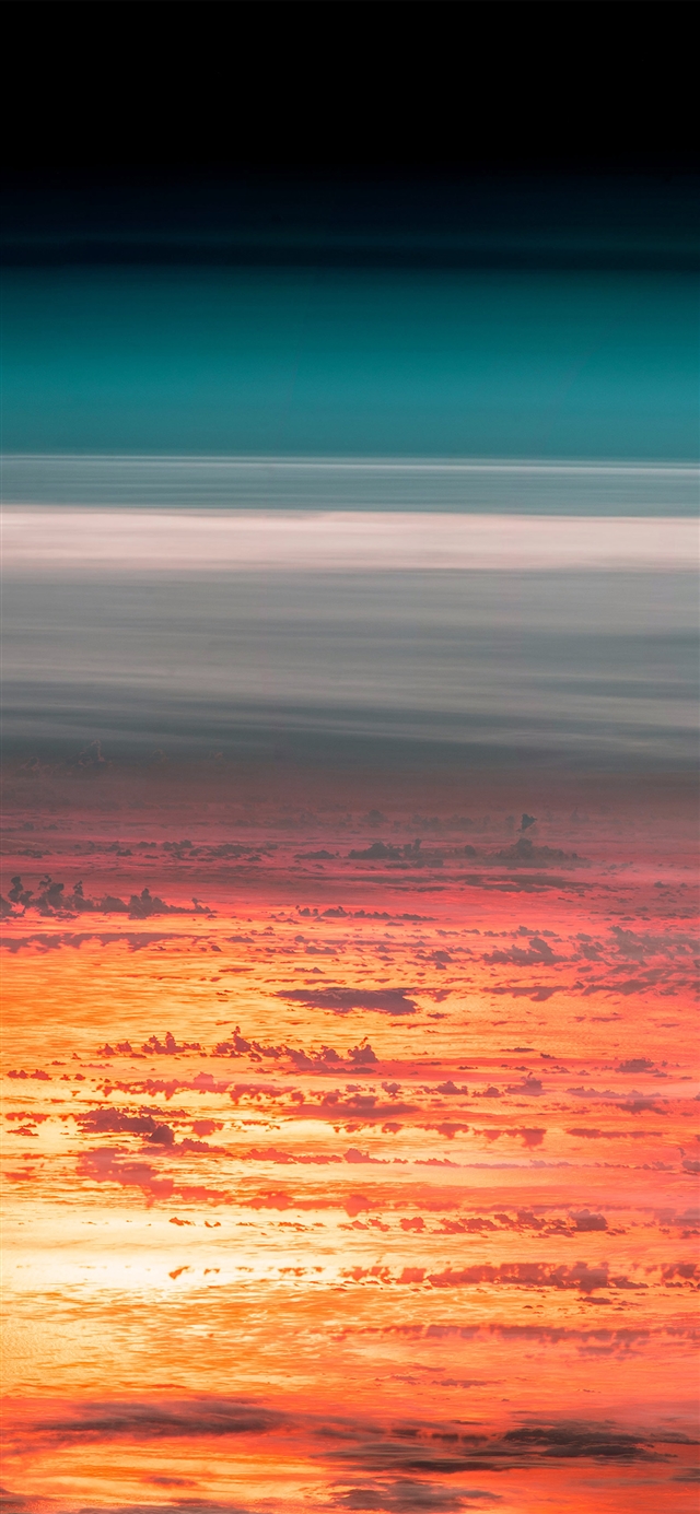 Sunset sky from space iPhone X wallpaper 