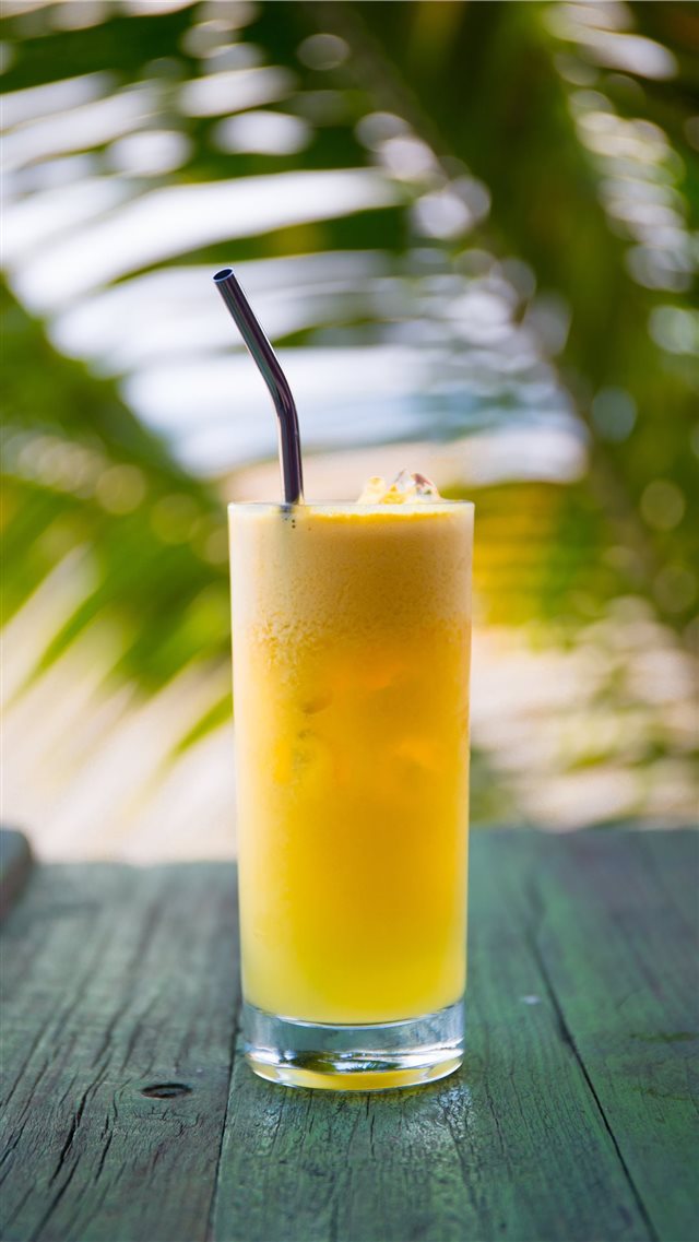 Fresh Pineapple Juice with Stainless Steel Straw iPhone SE wallpaper 