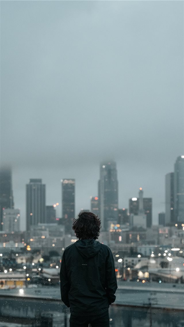 person standing an looking down iPhone 8 wallpaper 
