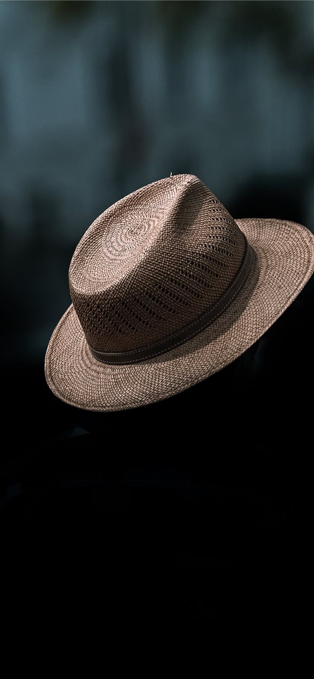 A Floating Hat  spotted in the streets of Saarbrü... iPhone X wallpaper 
