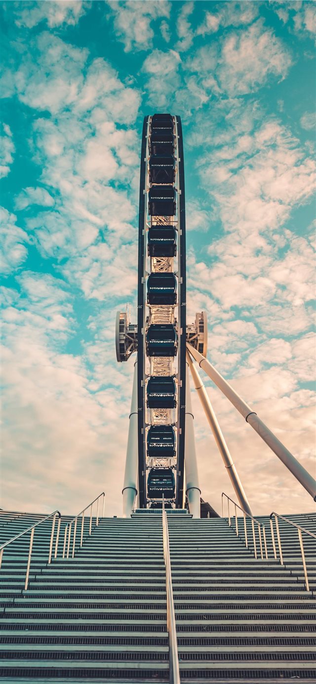 I took this shot walking past the Ferris Wheel fro... iPhone X wallpaper 
