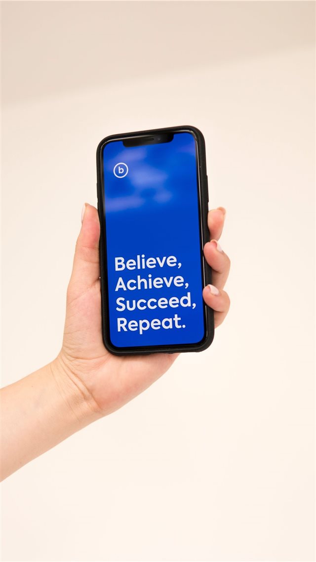 hand holding iphone x with cool quote iPhone 8 wallpaper 