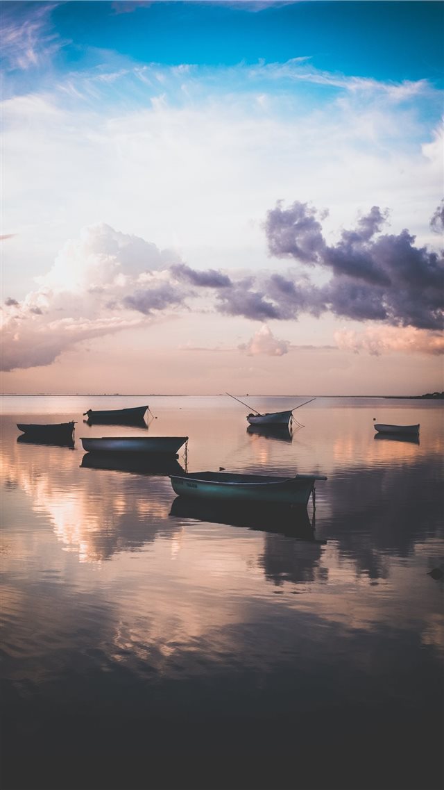 Sunset in Mauritius whilst the tide rolls in  iPhone 8 wallpaper 