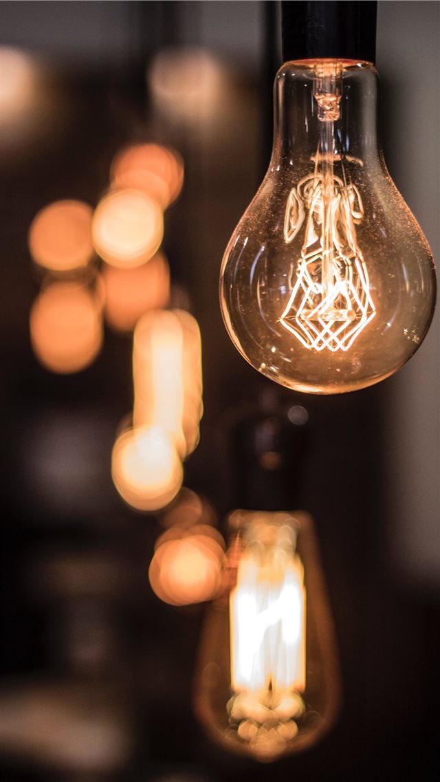 Vintage lightbulb inside a coffee shop in Mexico C... iPhone 8 wallpaper 