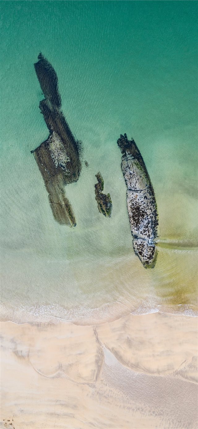 Nature's Shipwreck  Aerial photo of Kiloran Bay on... iPhone X wallpaper 