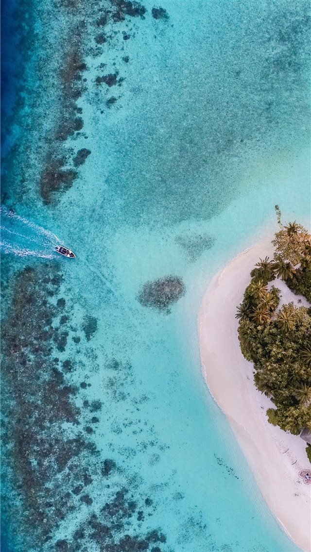 aerial photo of boat moving towards the white isla... iPhone 8 wallpaper 
