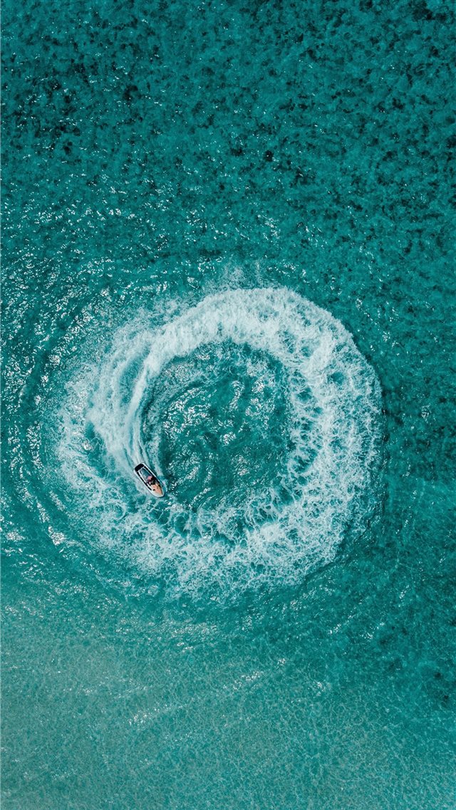 aerial shot person riding on personal watercraft iPhone 8 wallpaper 