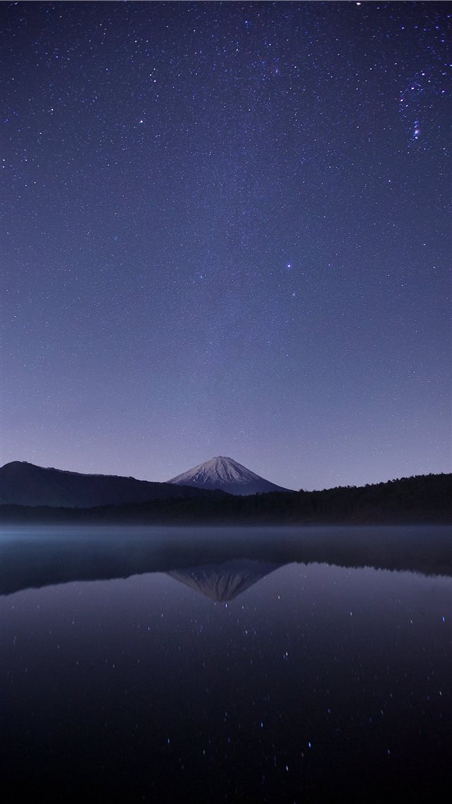 calm body of water near alp mountains during night... iPhone 8 wallpaper 