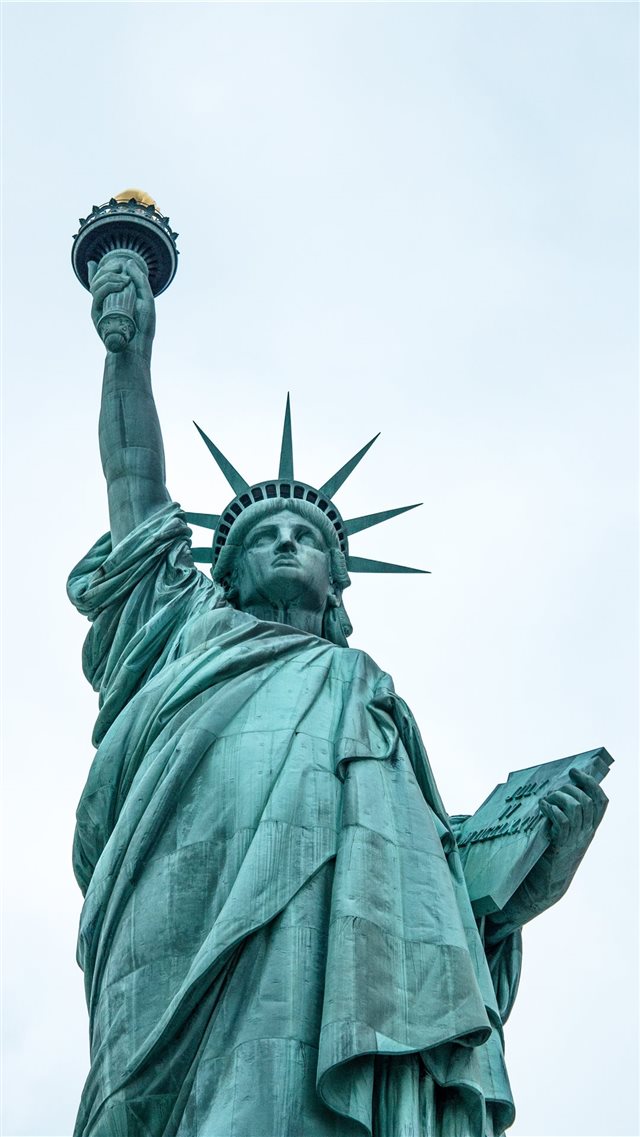low angle photography of Statue of Liberty iPhone 8 wallpaper 