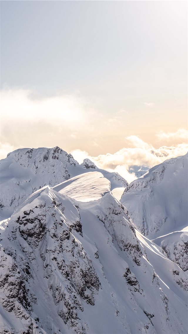 mountains covered by snow at daytime iPhone 8 wallpaper 
