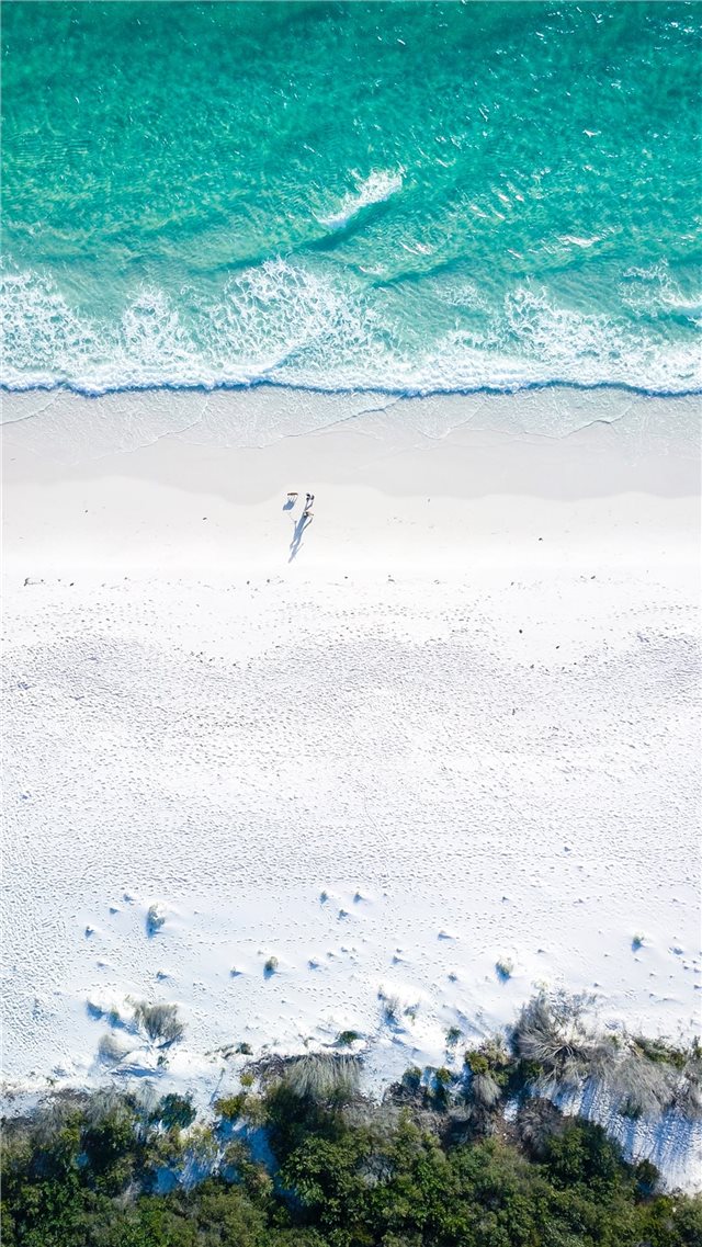 two people on beach during daytime iPhone 8 wallpaper 