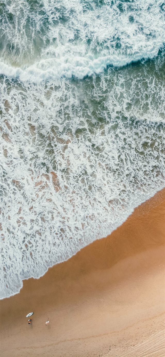 aerial photography of rampaging sea during daytime iPhone X wallpaper 