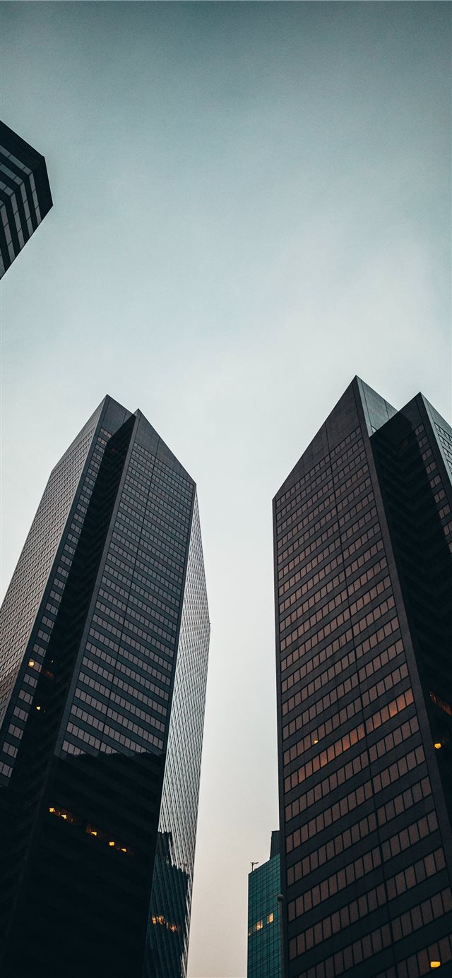 low angle photo of high rise building during dayti... iPhone X wallpaper 