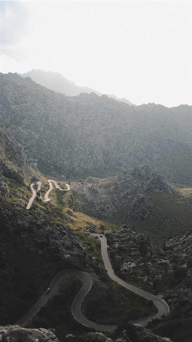 aerial photo of mountains covered by trees iPhone 8 wallpaper 