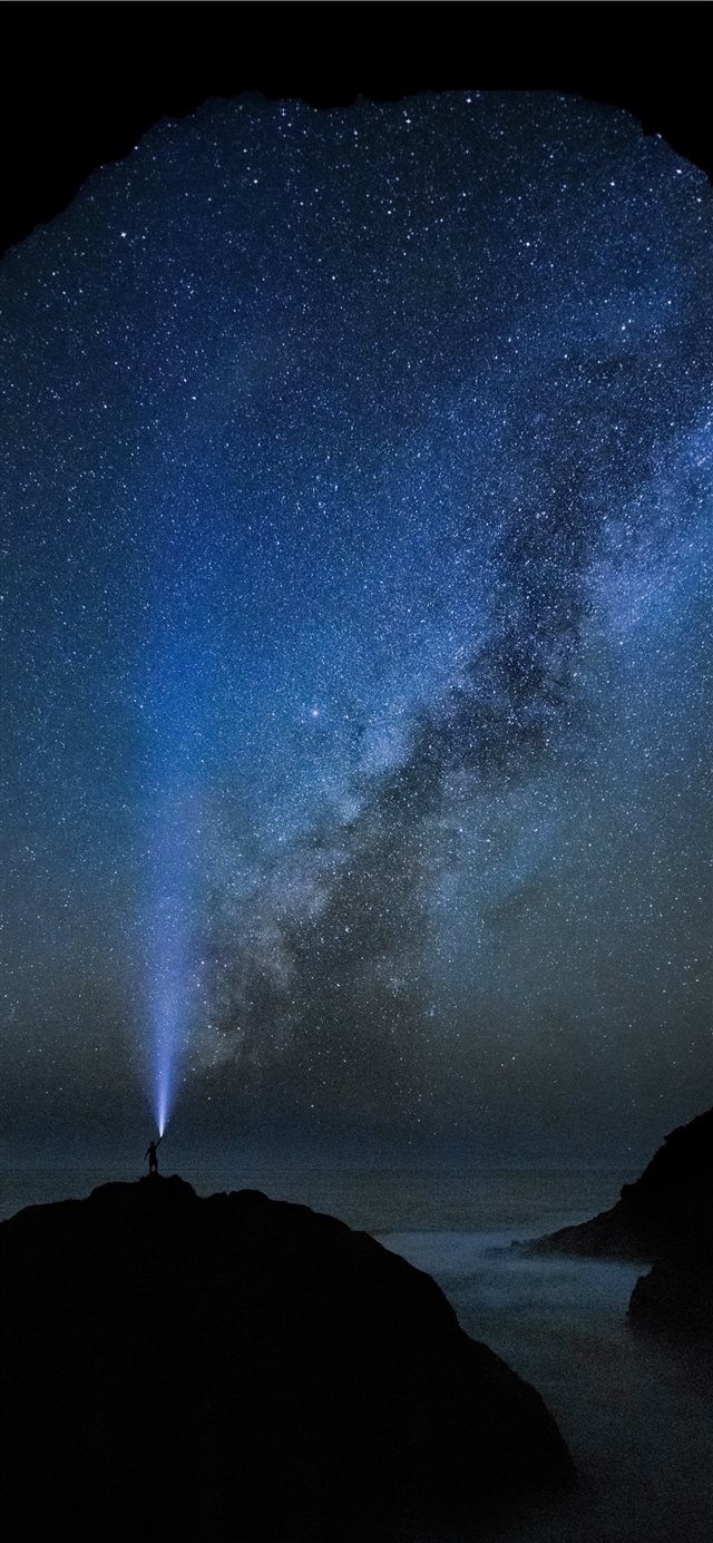 blue light under starry sky iPhone X wallpaper 
