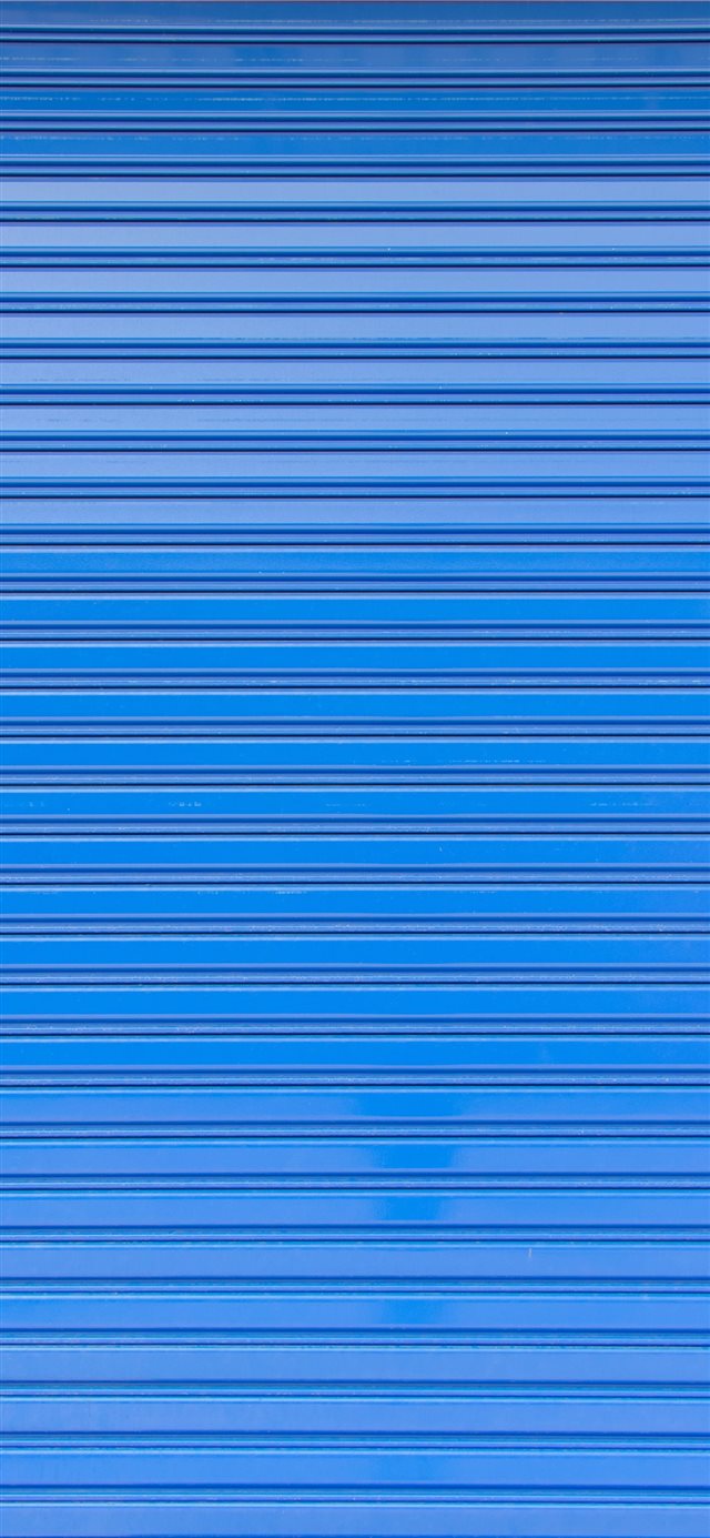 Blue roller shutter of a warehouse iPhone X wallpaper 