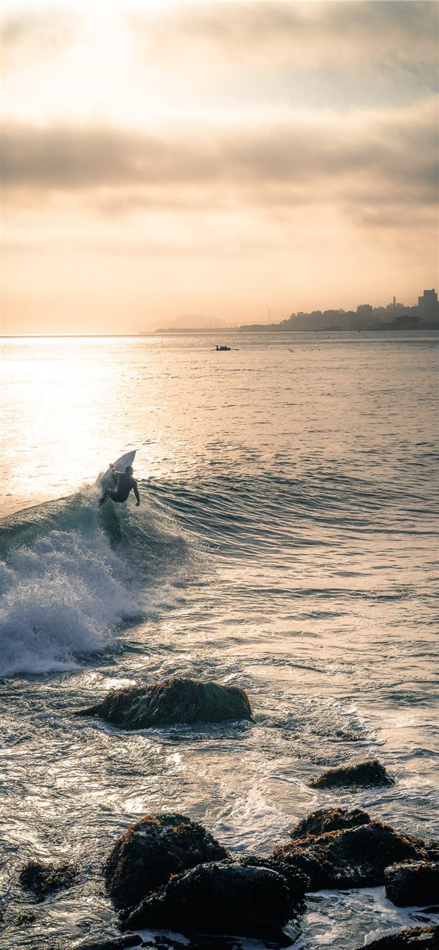 person surfing iPhone X wallpaper 
