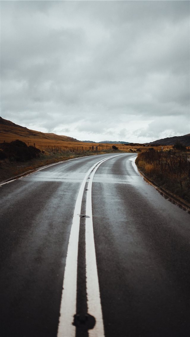 road under cloudy sky iPhone SE wallpaper 