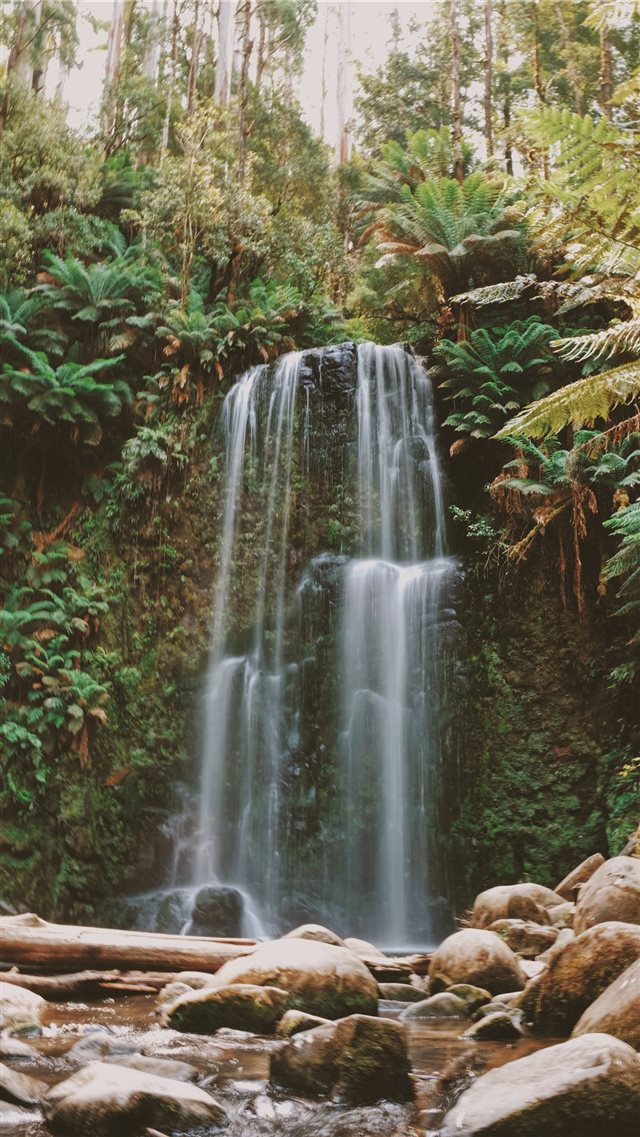 timelapse photo of waterfall facing rocks iPhone 8 wallpaper 