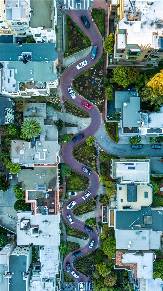 curved road during daytime iPhone 8 wallpaper 
