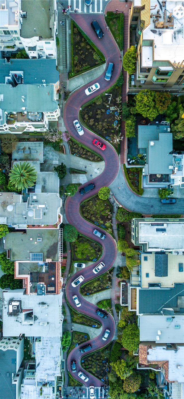 curved road during daytime iPhone X wallpaper 
