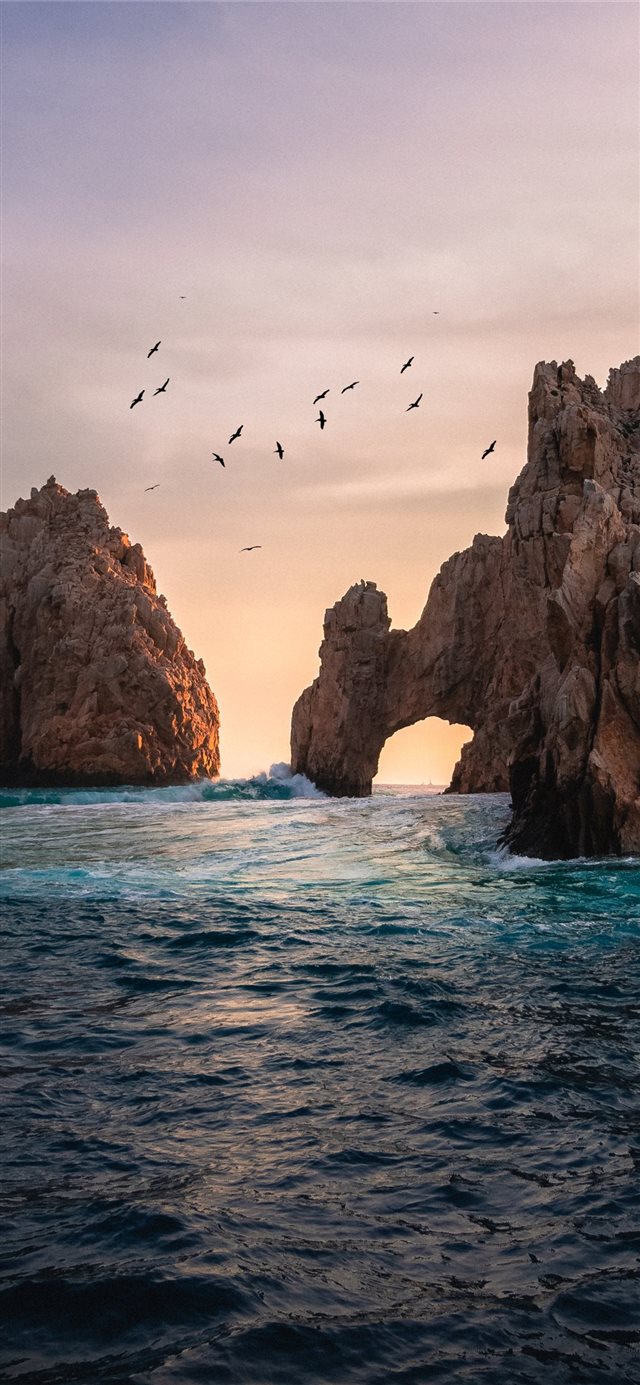 rock formation on the ocean photography iPhone X wallpaper 