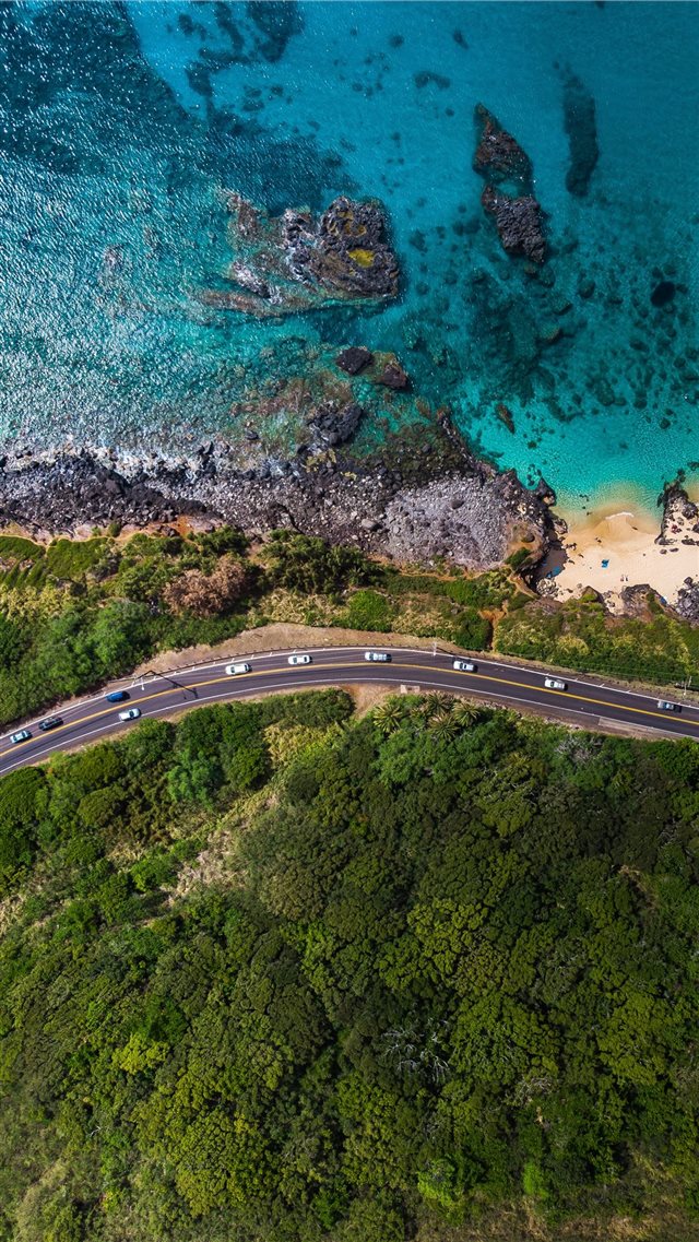 aerial view of road near body of water during dayt... iPhone 8 wallpaper 