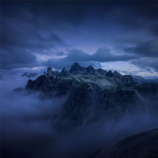 2048x2048 mountains cliff covered under fog mist 5k - blue iPad Air Wallpaper