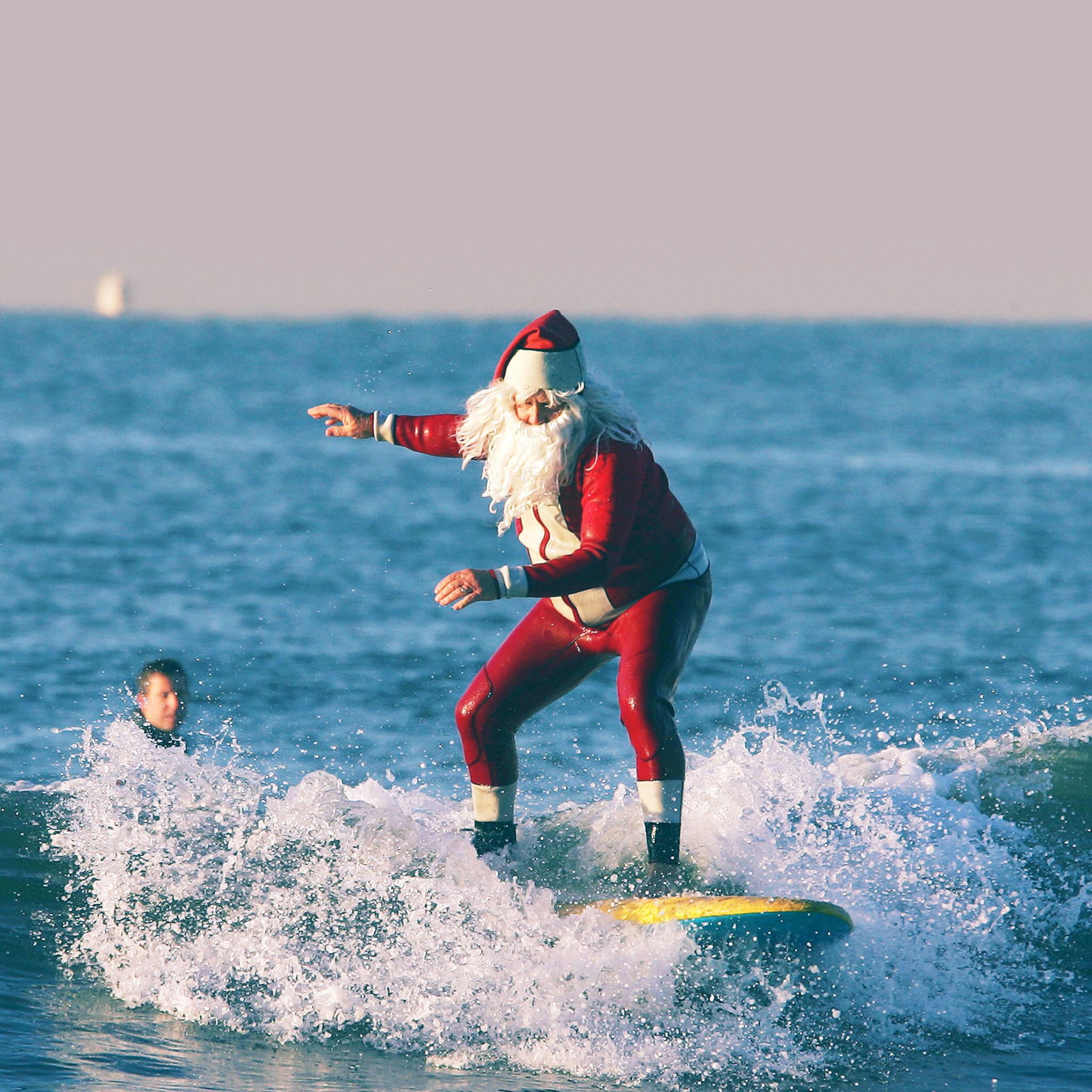 Surfing Santa Claus iPad Air wallpaper 