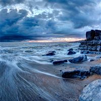 sea water rocks clouds long exposure 4k wallpaper