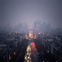 City skyscrapers clouds rain road cars lights iPad Pro wallpaper