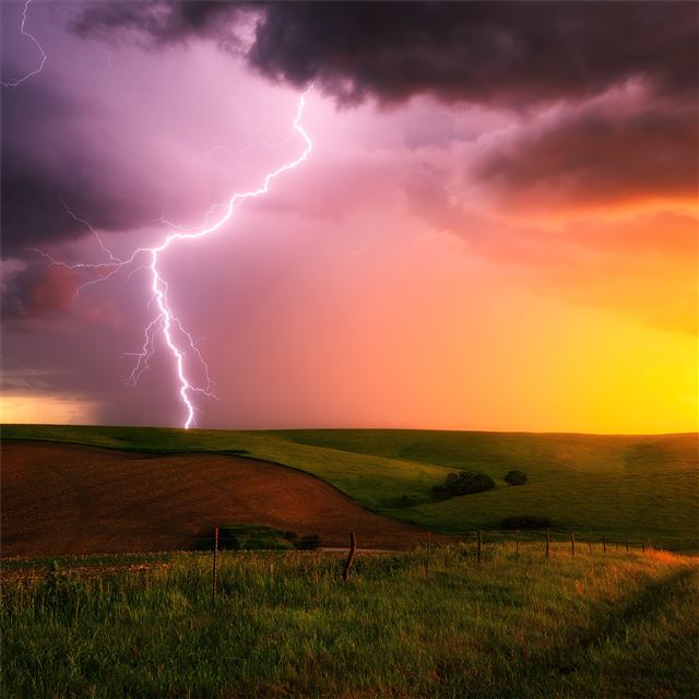 1024x1024 thunderstorm lightning bolt striking down at sunse... - lightning iPad Wallpaper