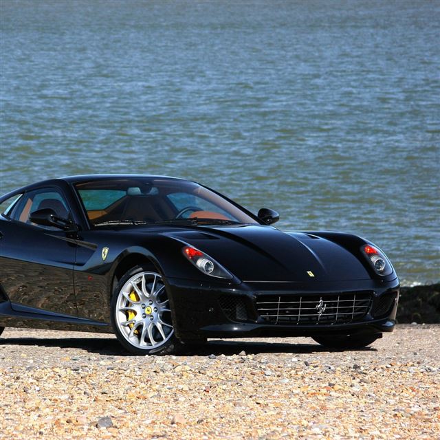 1024x1024 Ferrari Black Front View Beach - luxury car iPad Wallpaper