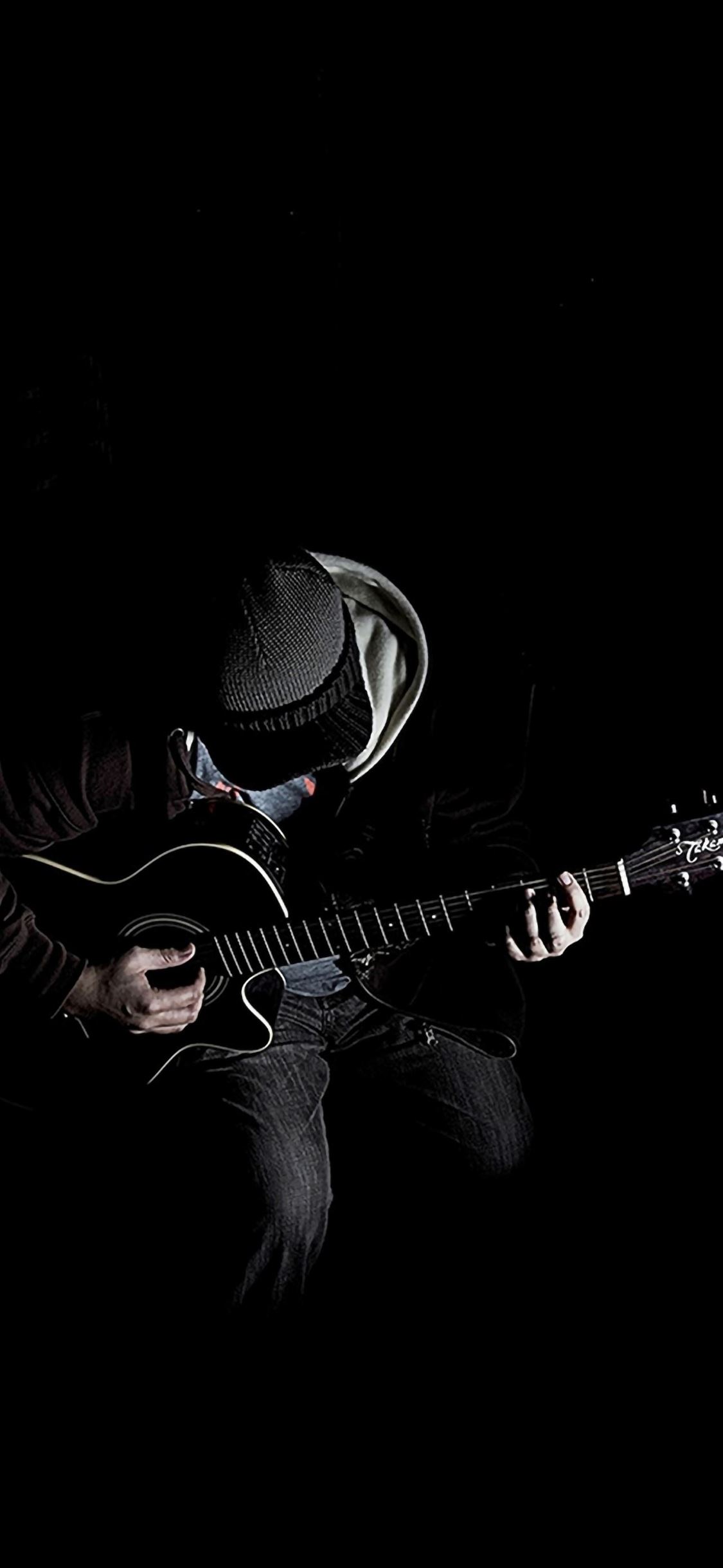 Out Of Dark Guitar Player Music iPhone wallpaper 