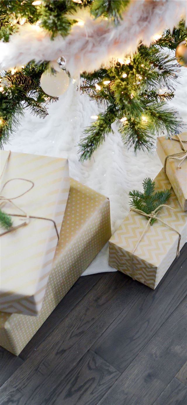 1125x2436 four gift boxes under Christmas tree - winter iPhone 11 Wallpaper