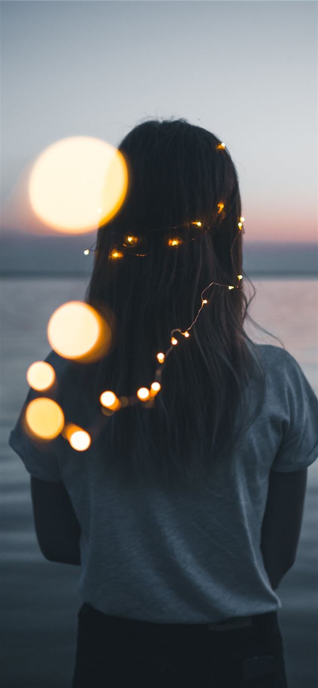 1125x2436 woman wearing white shirt facing the ocean photo d... -  iPhone 11 Wallpaper
