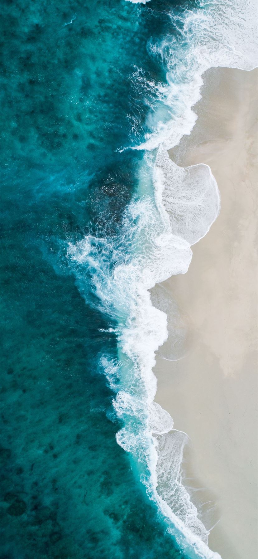 aerial photography of large body of water and shor... iPhone 11 wallpaper 