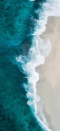 aerial photography of large body of water and shor... wallpaper