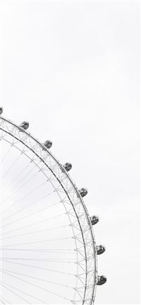 Part of a ferris wheel with enclosed cars for ridi... iPhone 11 wallpaper