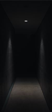 dark pathway lit with small light fixture iPhone 11 wallpaper