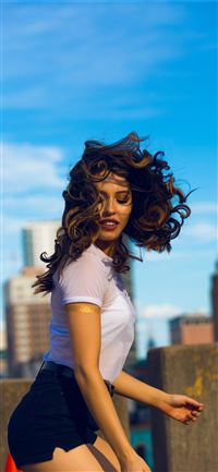 woman wearing white shirt standing wallpaper