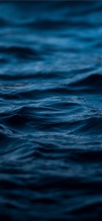 time lapse photography of blue sea iPhone 11 wallpaper