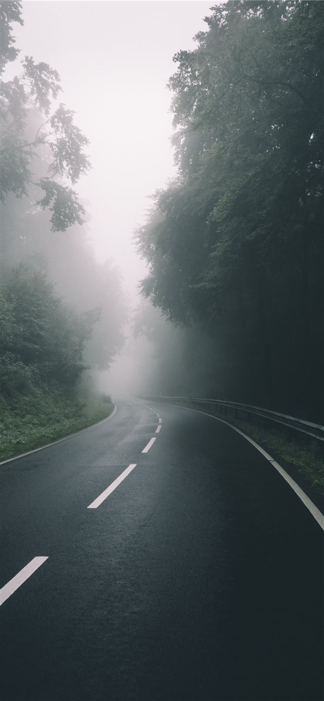 1125x2436 black concrete road during daytime - germany iPhone 11 Wallpaper