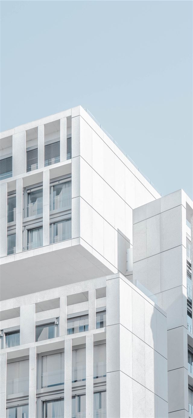 1125x2436 white modern cement building under blue sky - spain iPhone 11 Wallpaper