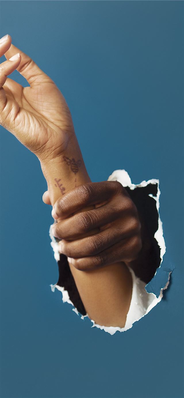 1125x2436 person holding right hand of another person - abstract iPhone 11 Wallpaper