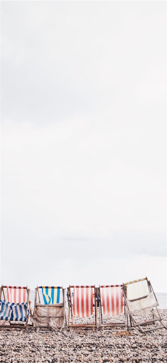 1125x2436 five chairs near costline - ocean iPhone 11 Wallpaper