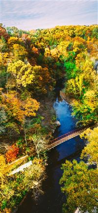 aerial photography of brown metal bridge surrounde... iPhone 11 wallpaper