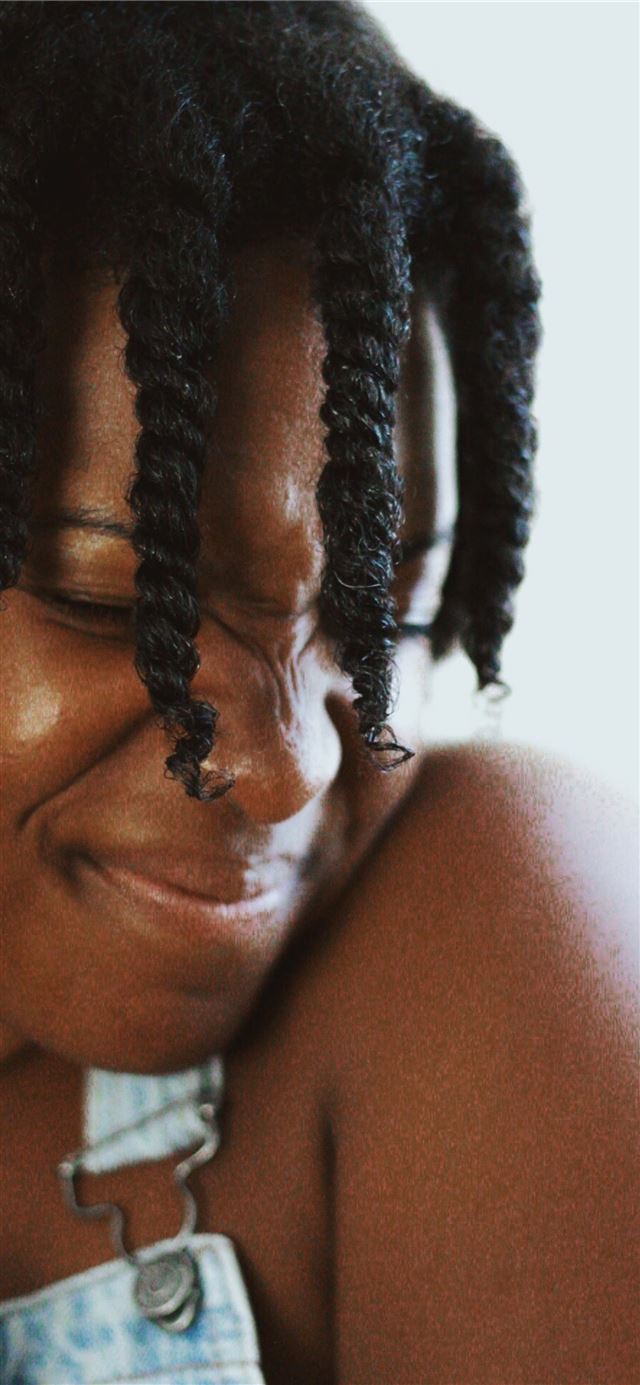 1125x2436 woman standing near white wall - cute iPhone 11 Wallpaper