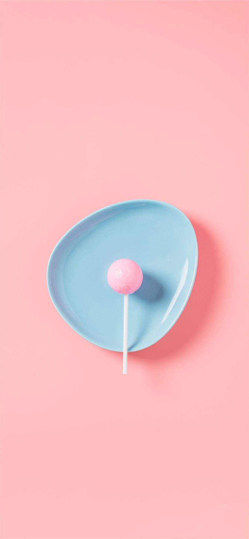 lollipop in blue plate iPhone 11 wallpaper 